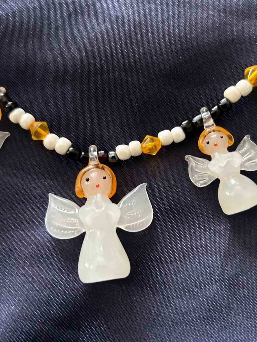 NECKLACE HANDBLOWN GLASS ANGELS WITH GOLD/WHITE/BLACK BEADS 21 INCHES, TAGS ON,